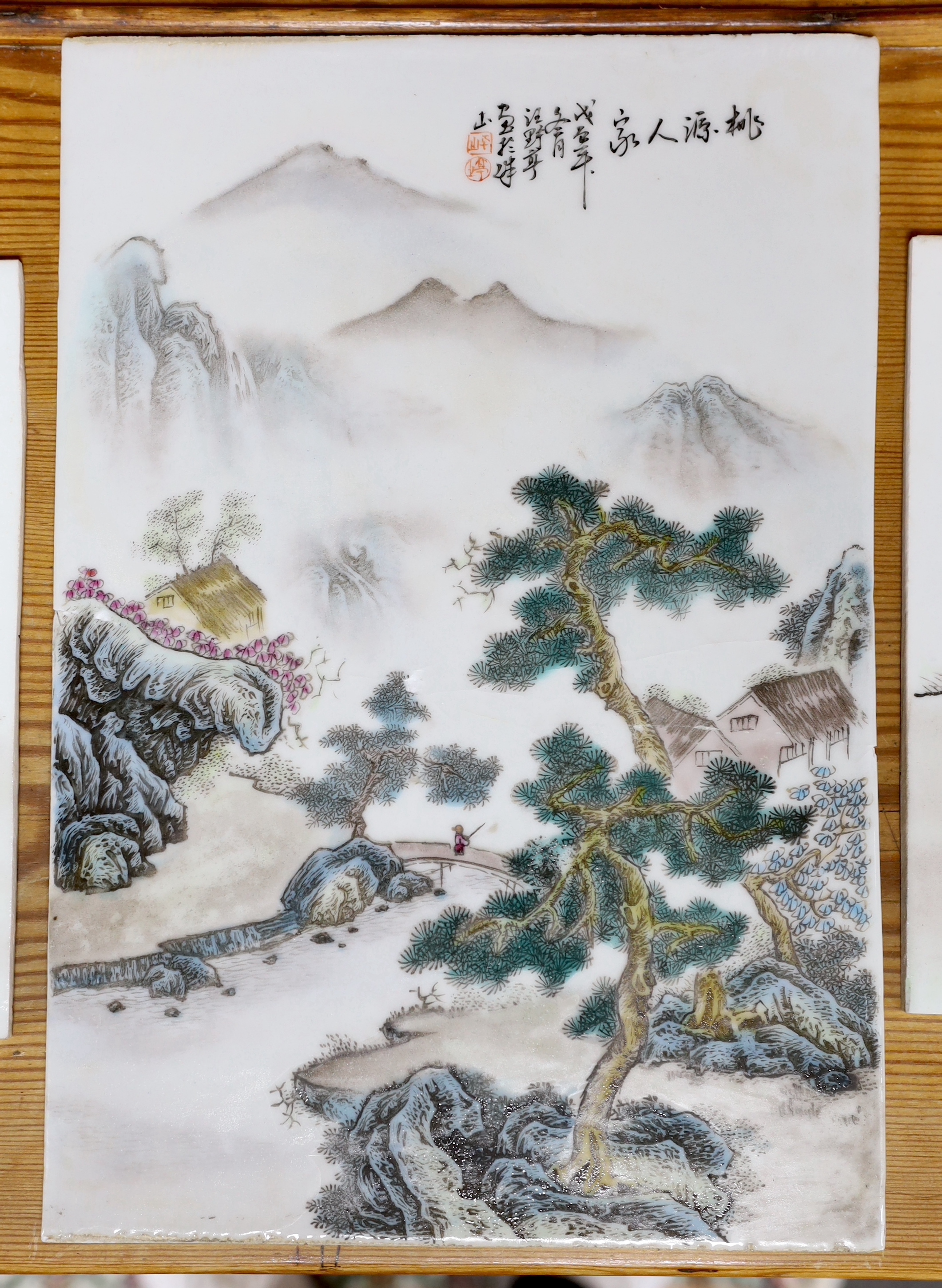 An early 20th century Chinese famille rose plaque and two others, largest 36cm high x 24.5cm wide